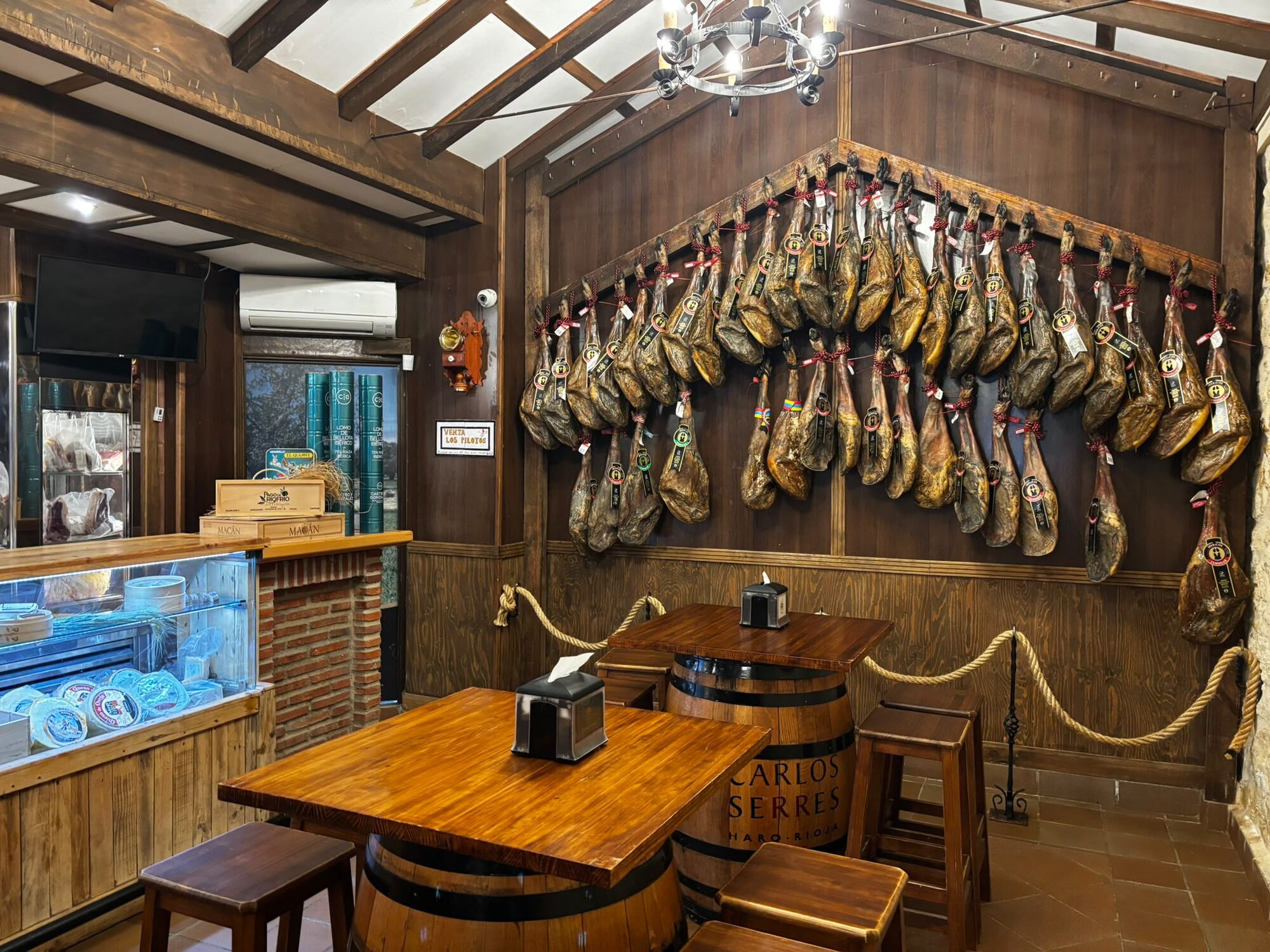 A traditional bar hung with cured Iberian hams